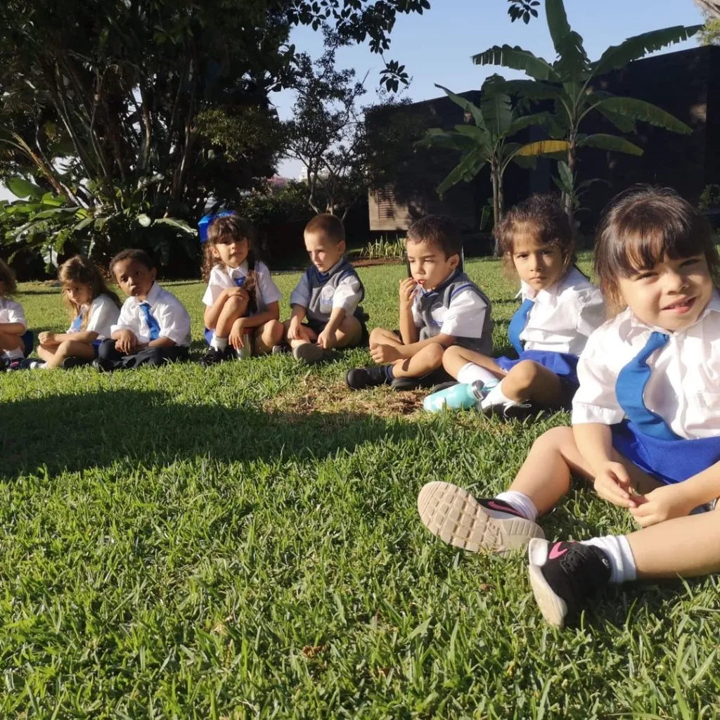 Early years children outdoors at ISM
